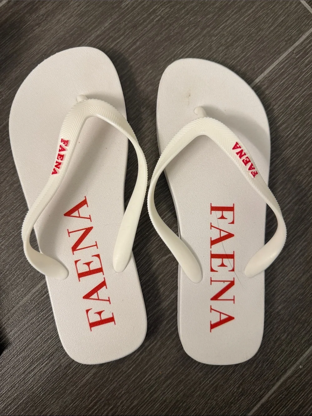 Women’s White Flip Flop Sandals with Red Logo